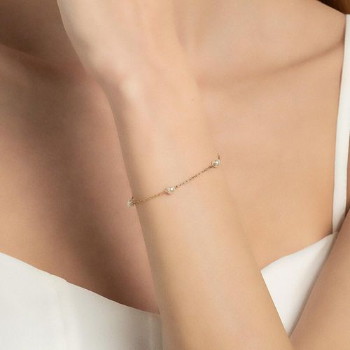 PULSEIRA BANHADA A OURO 18K COM PÉROLAS SINTÉTICAS