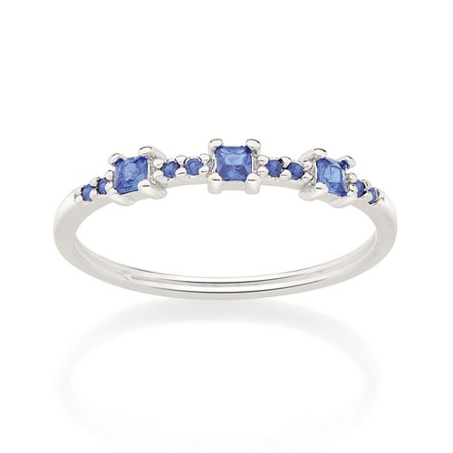 MEIA ALIANÇA BANHADA A RHODIUM COM ZIRCÔNIAS AZUIS